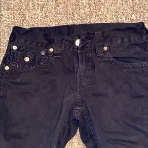 Straight black jeans cut bottoms